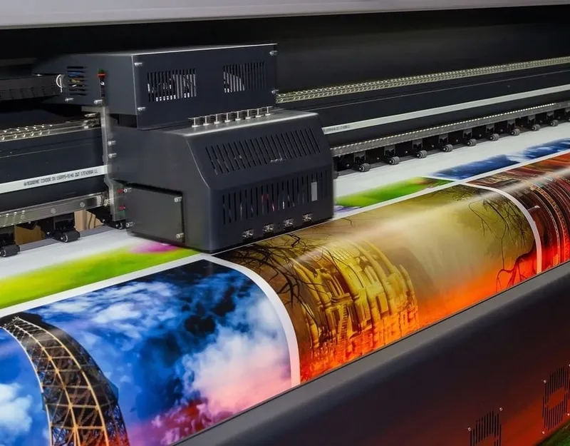 Gray metal building frame near tower crane during daytime